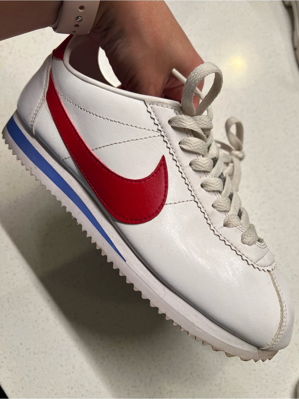 Nike White Leather Sneaker with Red Swoosh and Blue Stripe